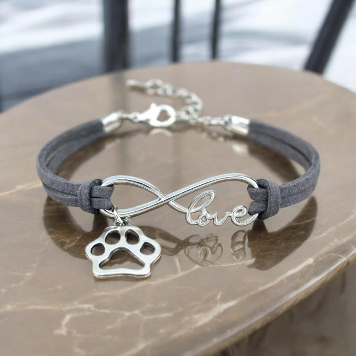 Armbånd med poteanheng infinity