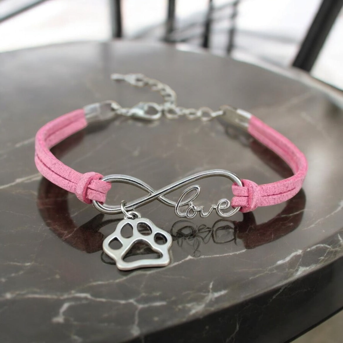 Armbånd med poteanheng infinity