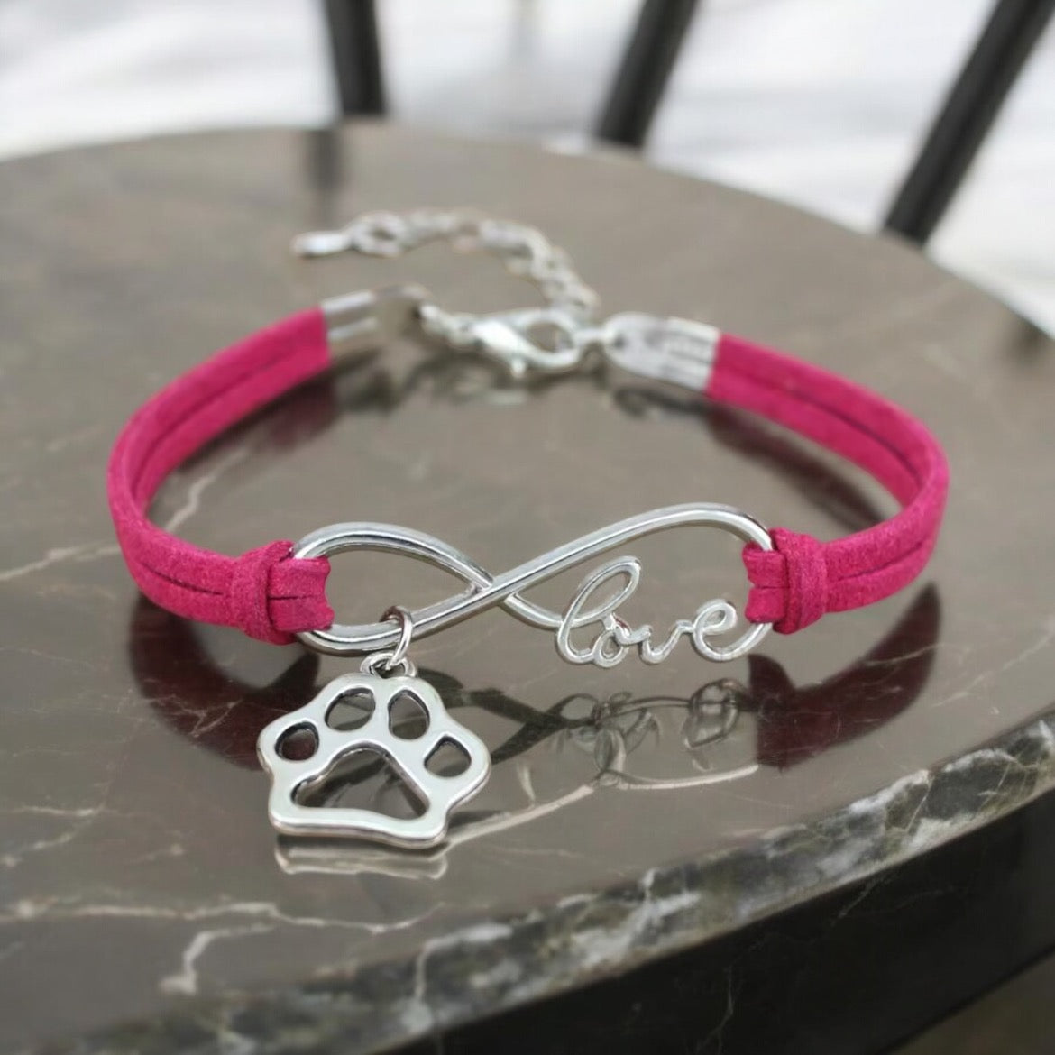 Armbånd med poteanheng infinity