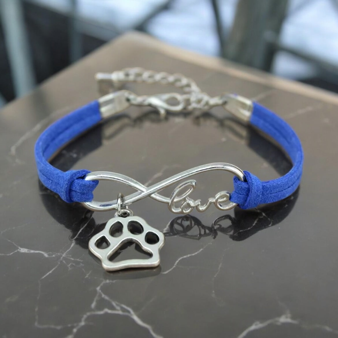 Armbånd med poteanheng infinity