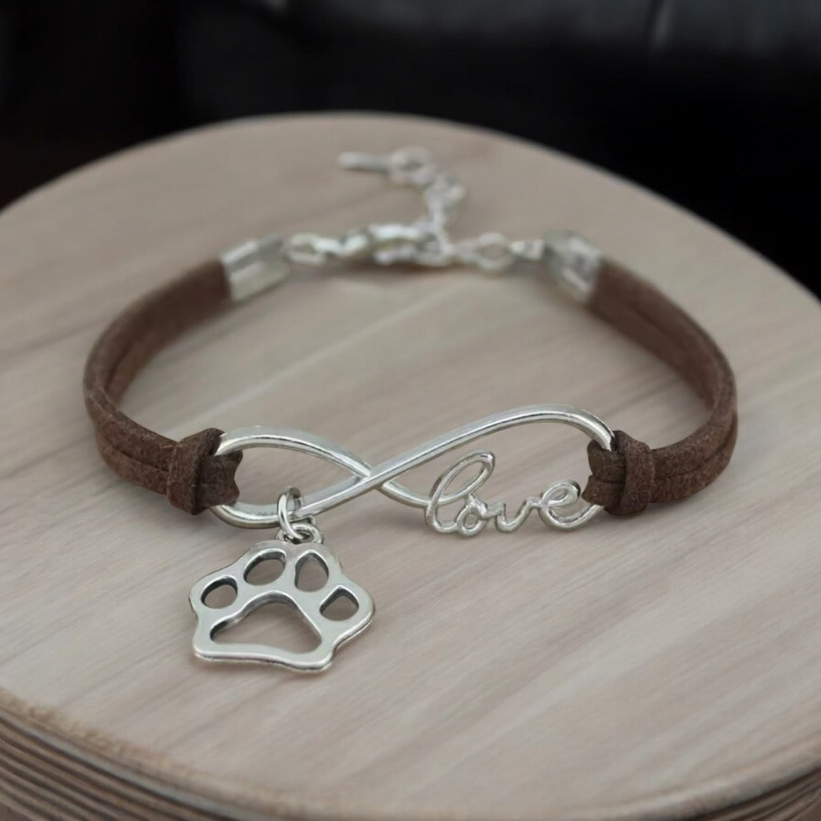 Armbånd med poteanheng infinity