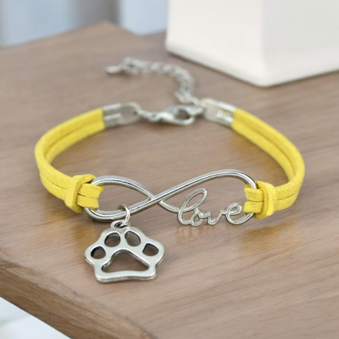 Armbånd med poteanheng infinity